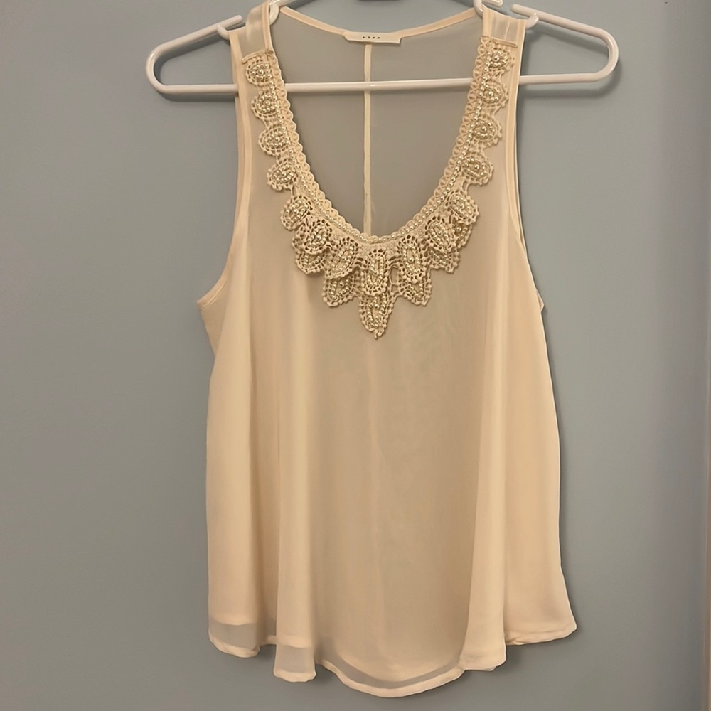 Cream tank top with faux pearl-beaded neckline from Lush